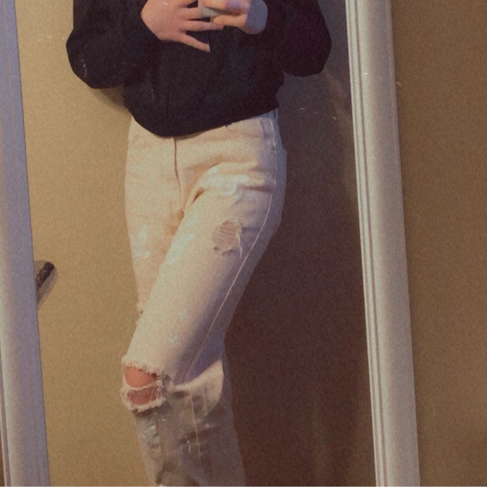Cream Ripped Jeans with Butterfly Patterns